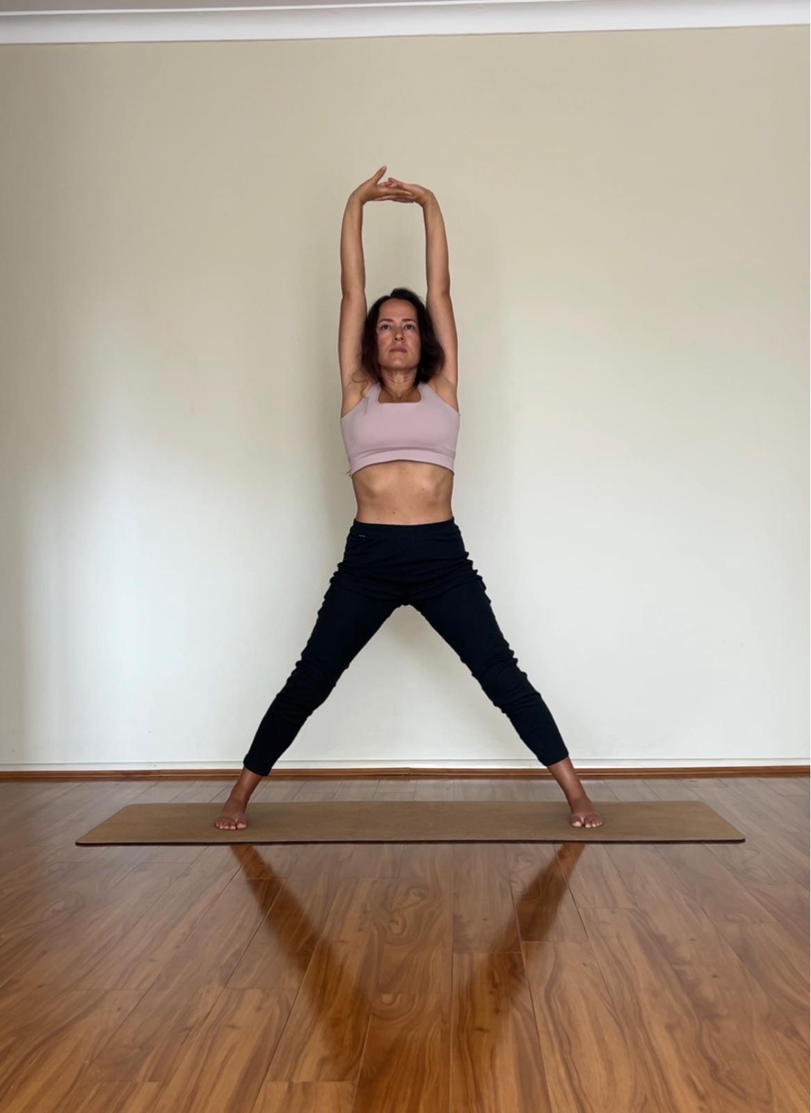 Diana demonstrating a hip release yoga therapy pose